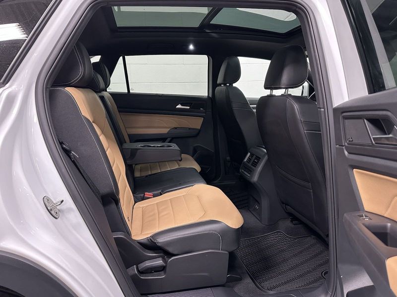 2023 Volkswagen Atlas Cross Sport SEL Premium R-Line AWD w/Sunroof & Navi in a Opal White Pearl exterior color and Cinnamon Brown Heated & Vented Leatherinterior. Schmelz Countryside Alfa Romeo and Fiat (651) 968-0556 schmelzfiat.com 