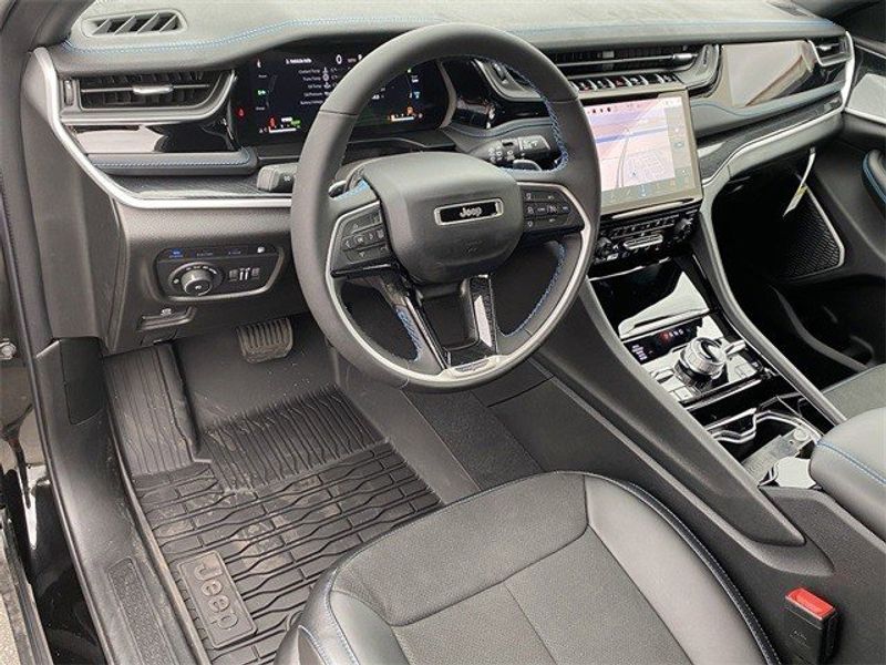 2023 Jeep Grand Cherokee Trailhawk 4xe in a Diamond Black Crystal Pearl Coat exterior color and Global Blackinterior. McPeek