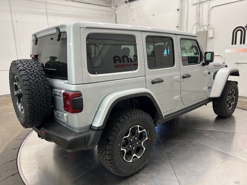 2023 Jeep Wrangler Rubicon 4xe in a Silver Zynith Clear Coat exterior color and Blackinterior. Marina Chrysler Dodge Jeep RAM (855) 616-8084 marinadodgeny.com 