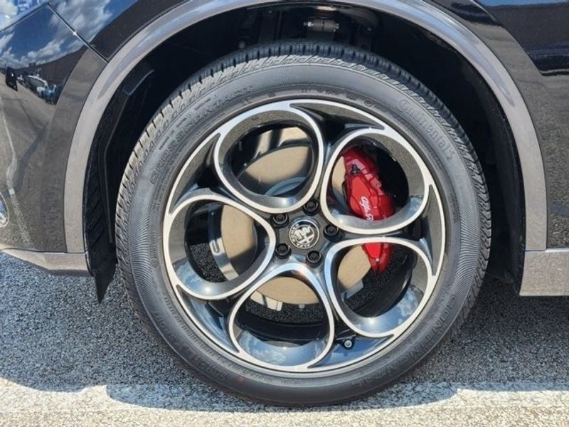 2024 Alfa Romeo Stelvio Ti Awd in a Vulcano Black Metallic exterior color and Chocolateinterior. Northside Alfa Romeo of Houston 281-475-4549 alfaromeousaofnorthhouston.com 