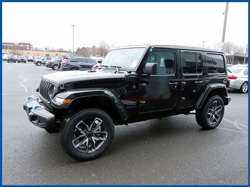 2024 Jeep Wrangler 4xE Sport S 4xe in a Black Clear Coat exterior color and Blackinterior. Papas Jeep Ram In New Britain, CT 860-356-0523 papasjeepram.com 