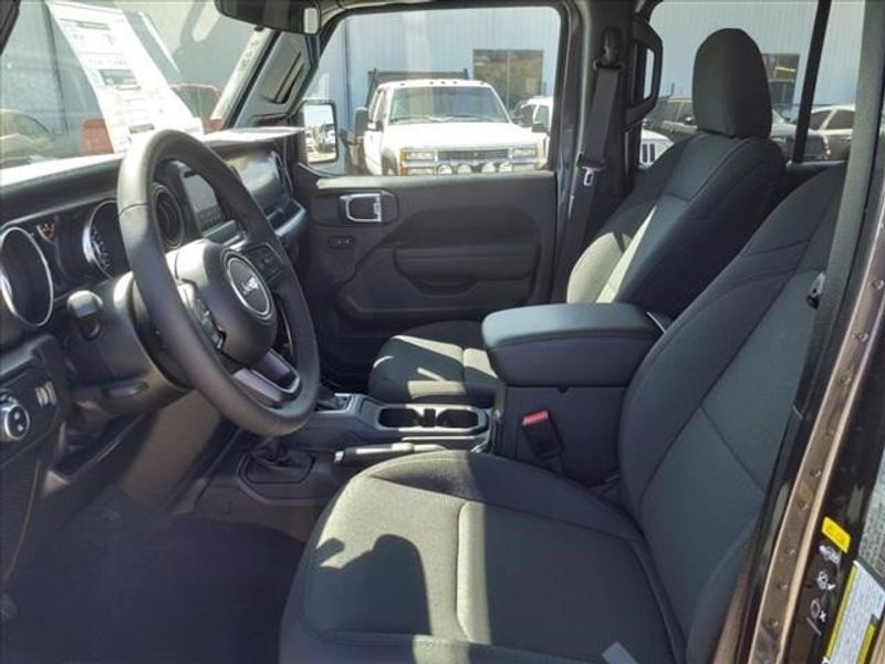 2023 Jeep Gladiator Sport in a Granite Crystal Metallic Clear Coat exterior color and Blackinterior. Perris Valley Auto Center 951-657-6100 perrisvalleyautocenter.com 