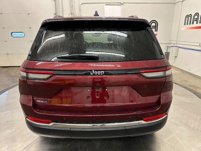 2024 Jeep Grand Cherokee 4xe in a Velvet Red Pearl Coat exterior color and Wicker Beige/Global Blackinterior. Marina Chrysler Dodge Jeep RAM (855) 616-8084 marinadodgeny.com 