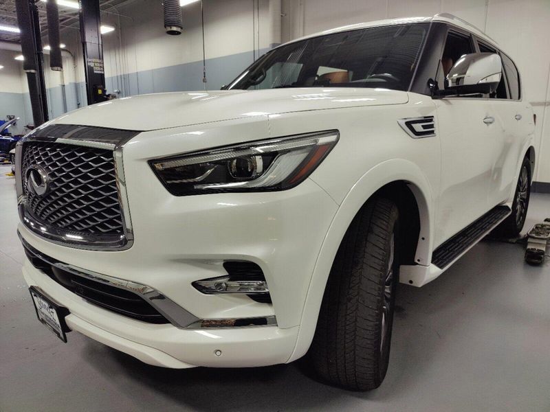 2023 INFINITI QX80 Sensory in a Moonstone White exterior color and Saddle Browninterior. Schmelz Countryside Alfa Romeo and Fiat (651) 968-0556 schmelzfiat.com 