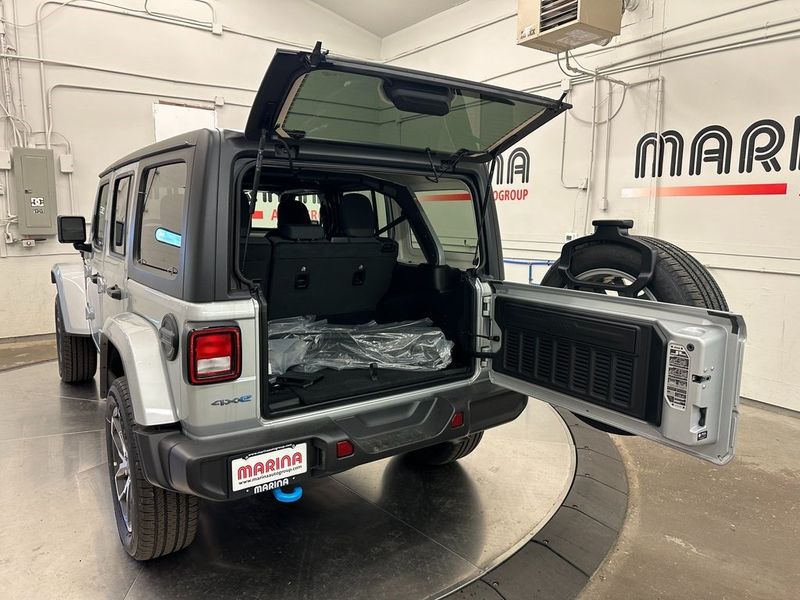 2024 Jeep Wrangler 4-door Sport S 4xe in a Silver Zynith Clear Coat exterior color and Blackinterior. Marina Auto Group (855) 564-8688 marinaautogroup.com 