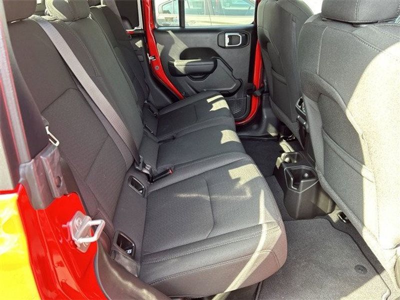 2023 Jeep Gladiator Sport S 4x4 in a Firecracker Red Clear Coat exterior color and Blackinterior. McPeek