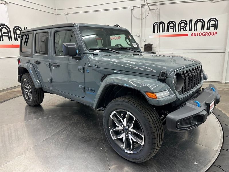 2024 Jeep Wrangler 4-door Sport S 4xe in a Anvil Clear Coat exterior color and Blackinterior. Marina Chrysler Dodge Jeep RAM (855) 616-8084 marinadodgeny.com 