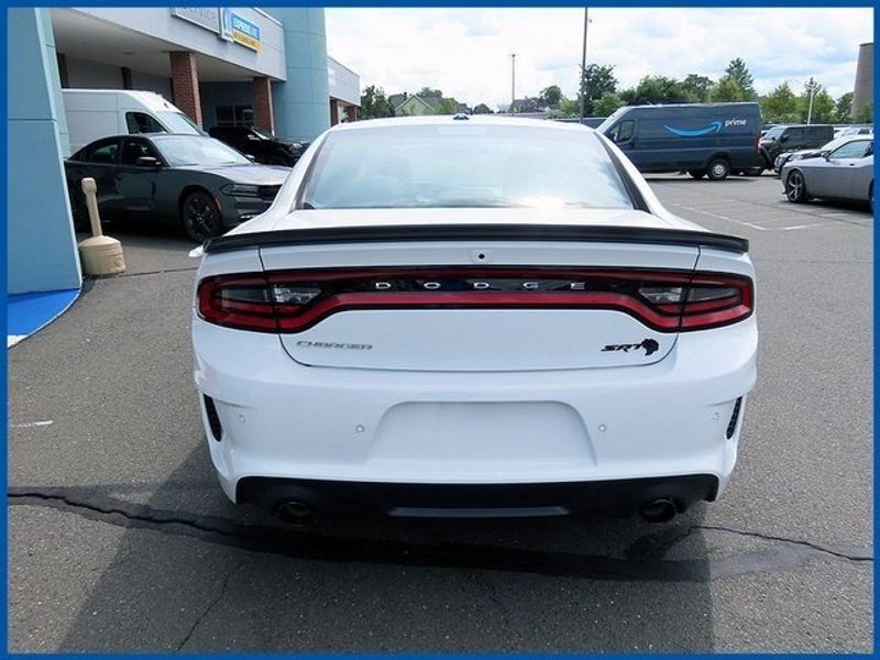 2023 Dodge Charger SRT Hellcat Widebody in a White Knuckle exterior color and Blackinterior. Papas Jeep Ram In New Britain, CT 860-356-0523 papasjeepram.com 