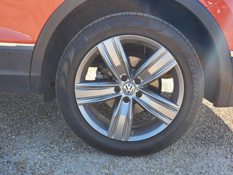 2019 Volkswagen Tiguan SEL Premium 4Motion in a ORANGE exterior color. Johnson Dodge 601-693-6343 pixelmotiondemo.com 