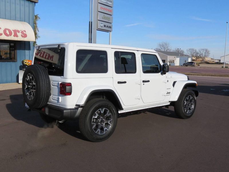 2024 Jeep Wrangler 4-door Sahara in a Bright White Clear Coat exterior color and Blackinterior. Militello Motors ​507-200-4344 militellomotors.net 