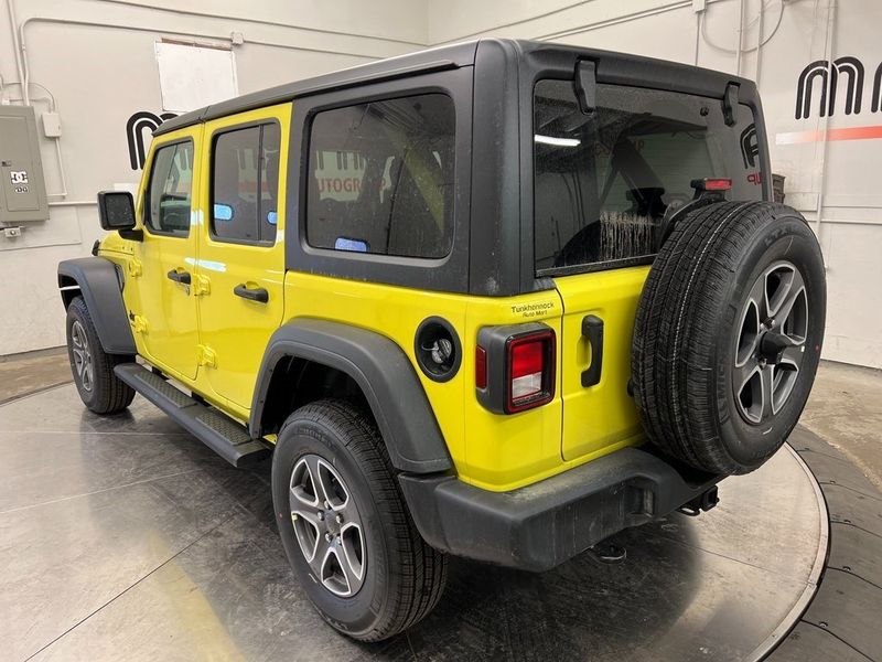 2023 Jeep Wrangler 4-door Sport S 4x4 in a High Velocity Clear Coat exterior color and Blackinterior. Marina Chrysler Dodge Jeep RAM (855) 616-8084 marinadodgeny.com 