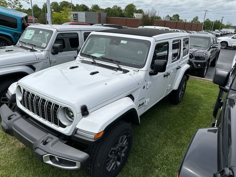 2024 Jeep Wrangler 4-door Sahara in a Bright White Clear Coat exterior color. Gupton Motors Inc 615-384-2886 guptonmotors.com 