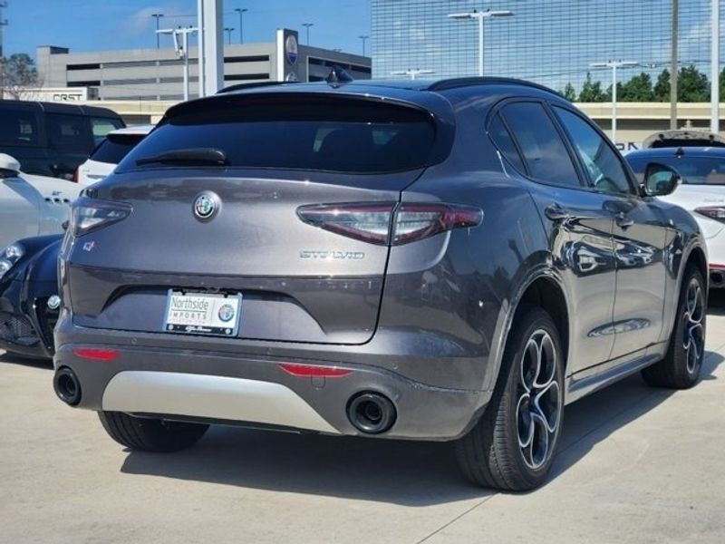 2024 Alfa Romeo Stelvio Ti in a Vesuvio Gray Metallic exterior color and Chocolateinterior. Northside Imports Houston 281-475-4549 northsideimportshouston.com 