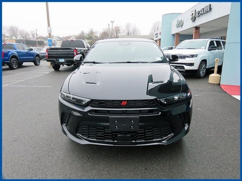 2024 Dodge Hornet R/T in a 8 Ball exterior color and Blackinterior. Papas Jeep Ram In New Britain, CT 860-356-0523 papasjeepram.com 