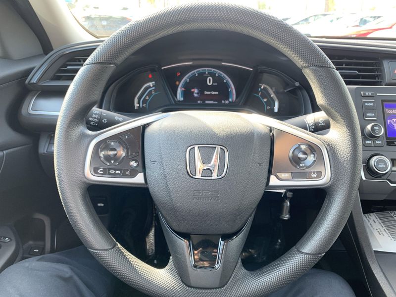 2020 Honda Civic Sedan LX in a White exterior color. BEACH BLVD OF CARS beachblvdofcars.com 