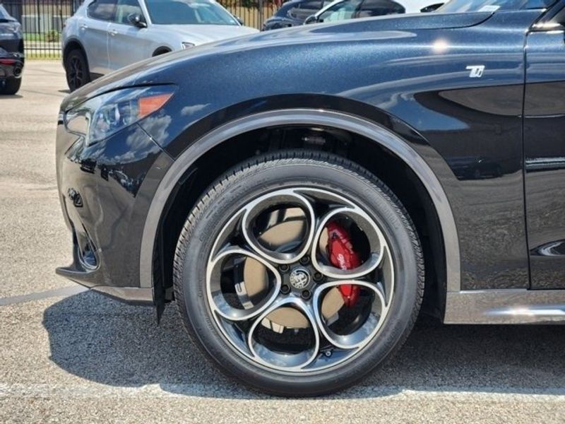 2024 Alfa Romeo Stelvio Ti Awd in a Vulcano Black Metallic exterior color and Chocolateinterior. Northside Alfa Romeo of Houston 281-475-4549 alfaromeousaofnorthhouston.com 