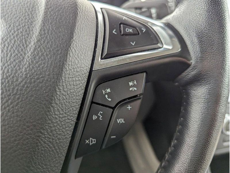 2022 Ford Edge Titanium in a Carbonized Gray Metallic exterior color and Medium Soft Ceramicinterior. Johnson Dodge 601-693-6343 pixelmotiondemo.com 