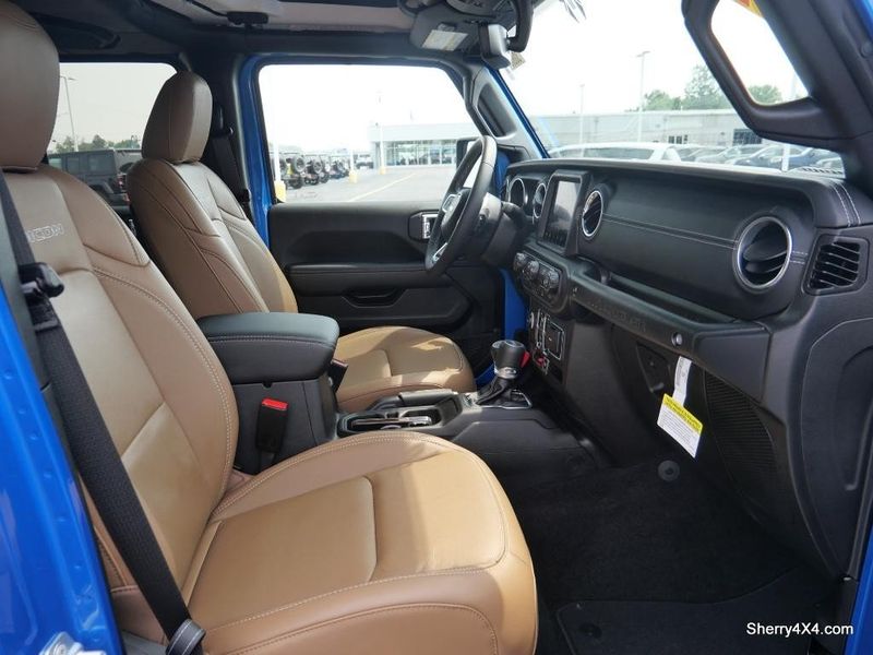 2023 Jeep Wrangler Rubicon 4xe in a Hydro Blue Pearl Coat exterior color and Black/Dark Saddleinterior. Paul Sherry Chrysler Dodge Jeep RAM (937) 749-7061 sherrychrysler.net 