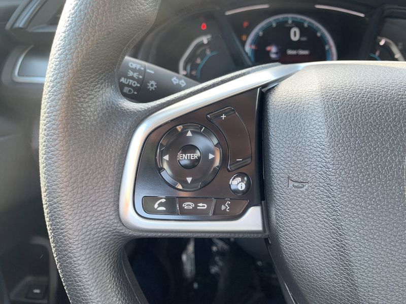2020 Honda Civic Sedan LX in a White exterior color. BEACH BLVD OF CARS beachblvdofcars.com 