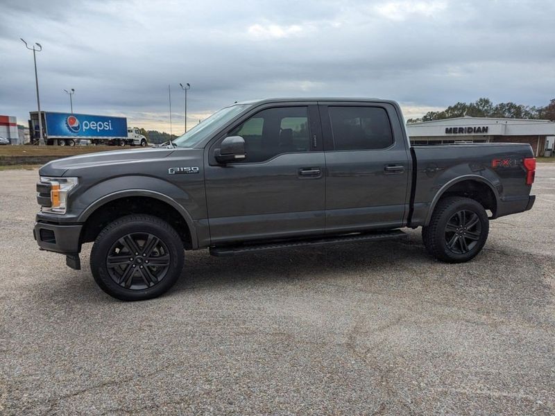 2020 Ford F-150 Lariat in a Magnetic Metallic exterior color and Blackinterior. Johnson Dodge 601-693-6343 pixelmotiondemo.com 