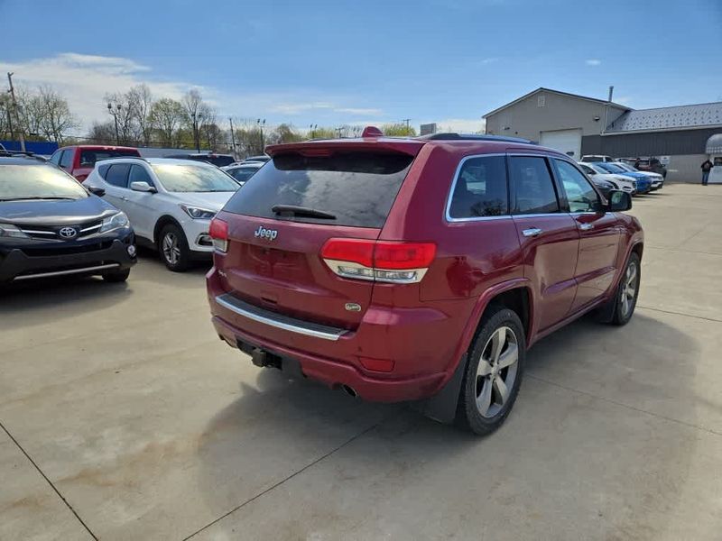 2014 Jeep Grand Cherokee Overland in a Deep Cherry Red Crystal Pearl Coat exterior color and Blackinterior. Dave Warren Chrysler Dodge Jeep Ram (716) 708-1207 davewarrenchryslerdodgejeepram.com 