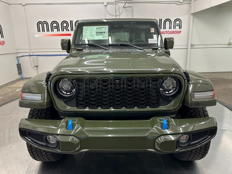 2024 Jeep Wrangler 4-door High Altitude 4xe in a Sarge Green Clear Coat exterior color and Green/Blackinterior. Marina Chrysler Dodge Jeep RAM (855) 616-8084 marinadodgeny.com 