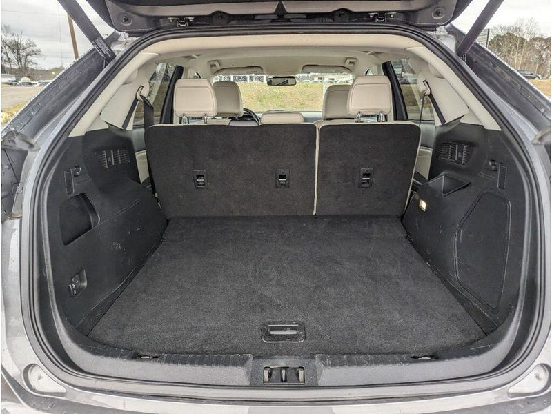 2022 Ford Edge Titanium in a Carbonized Gray Metallic exterior color and Medium Soft Ceramicinterior. Johnson Dodge 601-693-6343 pixelmotiondemo.com 