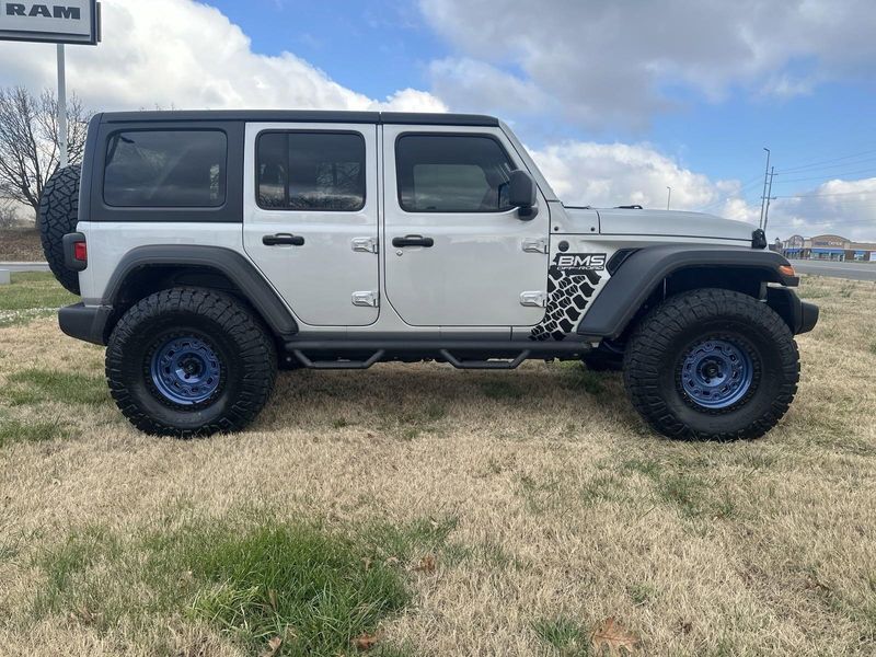 2024 Jeep Wrangler 4-door Sport S in a Silver Zynith Clear Coat exterior color and Blackinterior. Gupton Motors Inc 615-384-2886 guptonmotors.com 