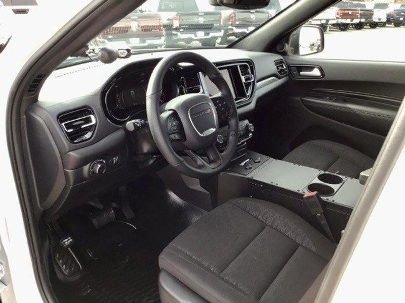 2023 Dodge Durango Pursuit in a White Knuckle Clear Coat exterior color and Blackinterior. Matthews Chrysler Dodge Jeep Ram 918-276-8729 cyclespecialties.com 