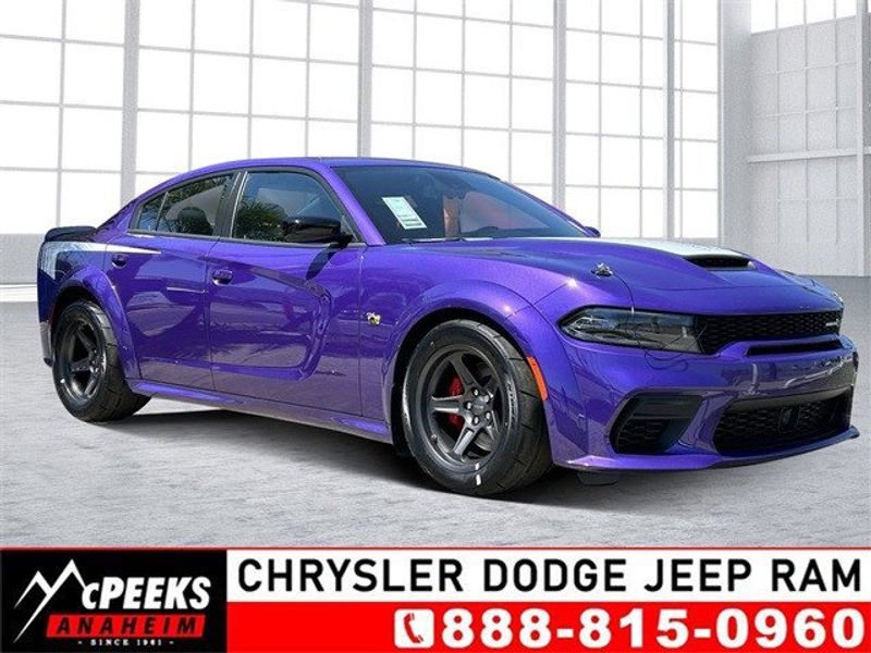 2023 Dodge Charger Super Bee in a Plum Crazy exterior color and Carboninterior. McPeek