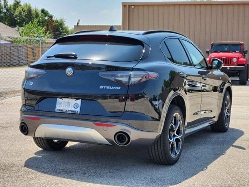 2024 Alfa Romeo Stelvio Ti in a Vulcano Black Metallic exterior color and Blackinterior. Northside Imports Houston 281-475-4549 northsideimportshouston.com 