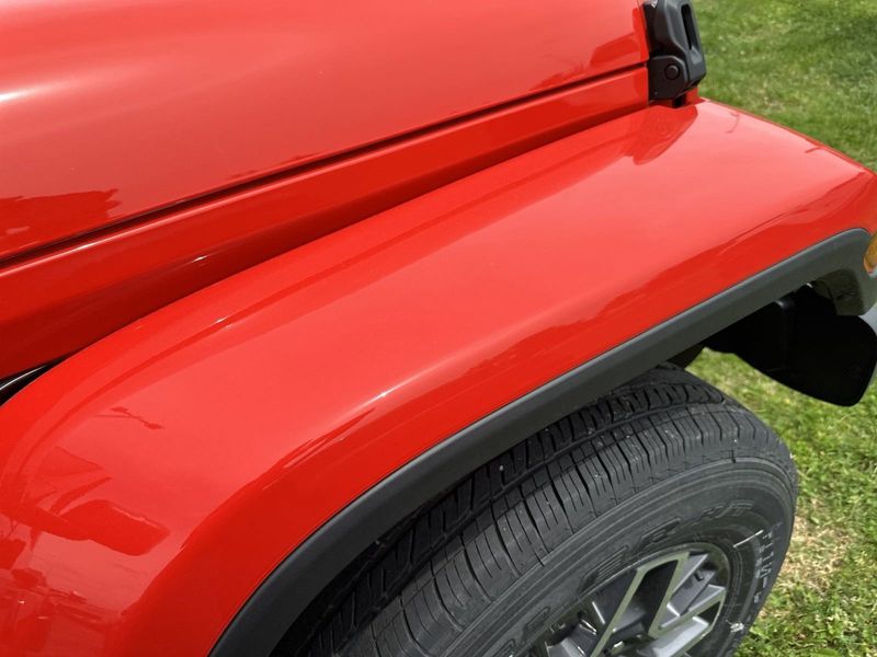 2024 Jeep Wrangler 4-door Sahara in a Firecracker Red Clear Coat exterior color. Gupton Motors Inc 615-384-2886 guptonmotors.com 