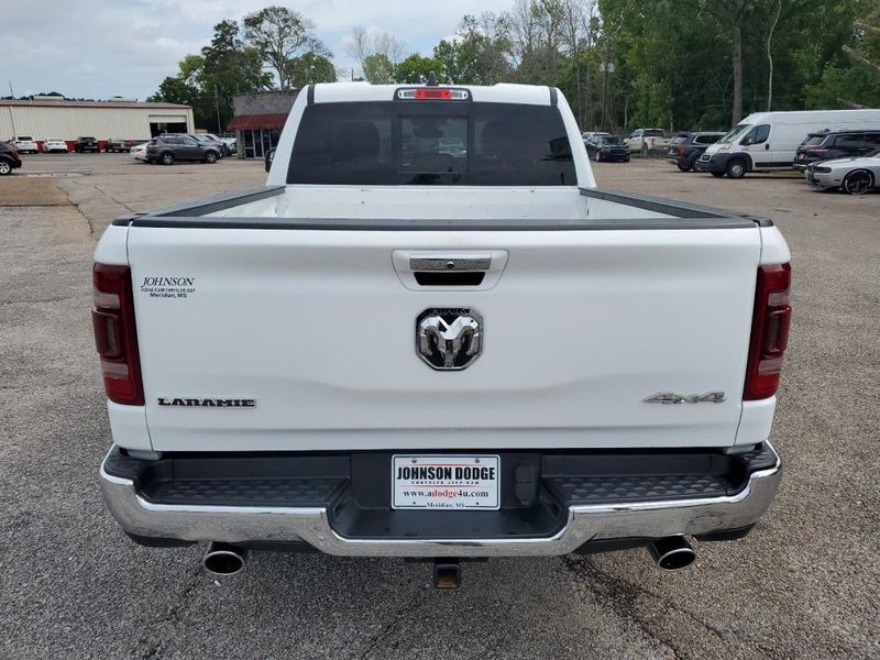 2020 RAM 1500 Laramie in a Bright White Clear Coat exterior color and Blackinterior. Johnson Dodge 601-693-6343 pixelmotiondemo.com 