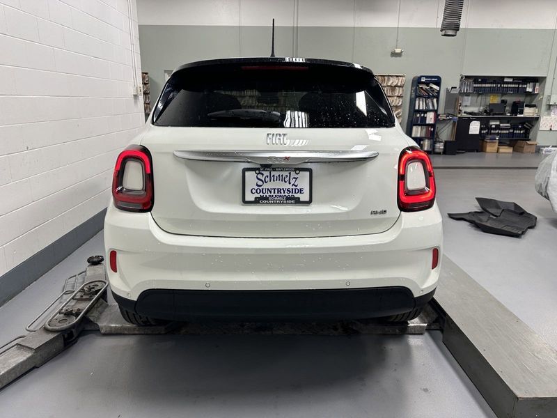 2023 Fiat 500x Pop Awd in a Bianco Gelato (White Clear Coat) exterior color and Blackinterior. Schmelz Countryside Alfa Romeo and Fiat (651) 968-0556 schmelzfiat.com 