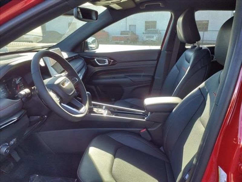 2024 Jeep Compass Trailhawk in a Prm exterior color and Ruby Red/Blackinterior. Perris Valley Auto Center 951-657-6100 perrisvalleyautocenter.com 