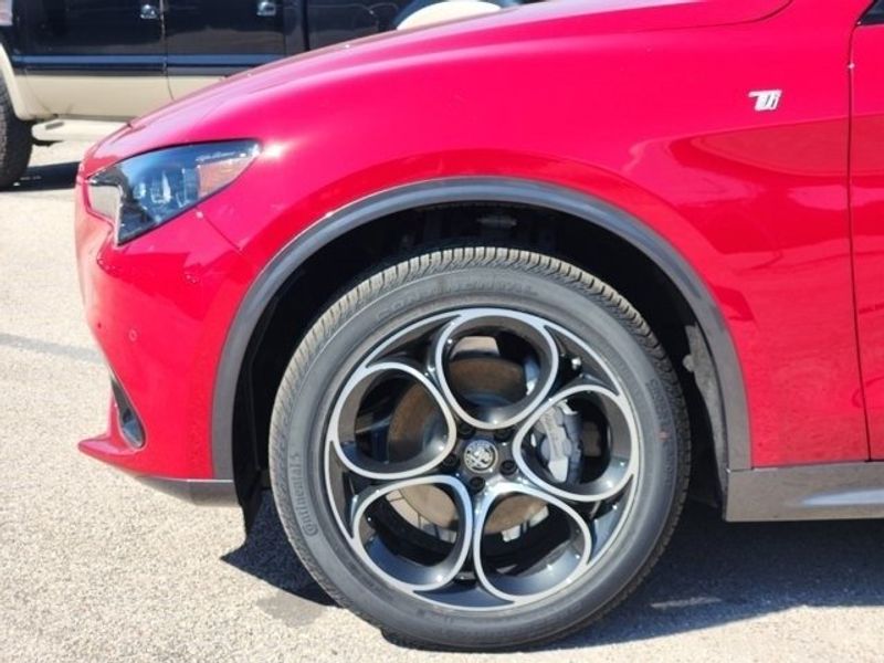 2024 Alfa Romeo Stelvio Ti in a Alfa Rosso exterior color and Blackinterior. Northside Imports Houston 281-475-4549 northsideimportshouston.com 