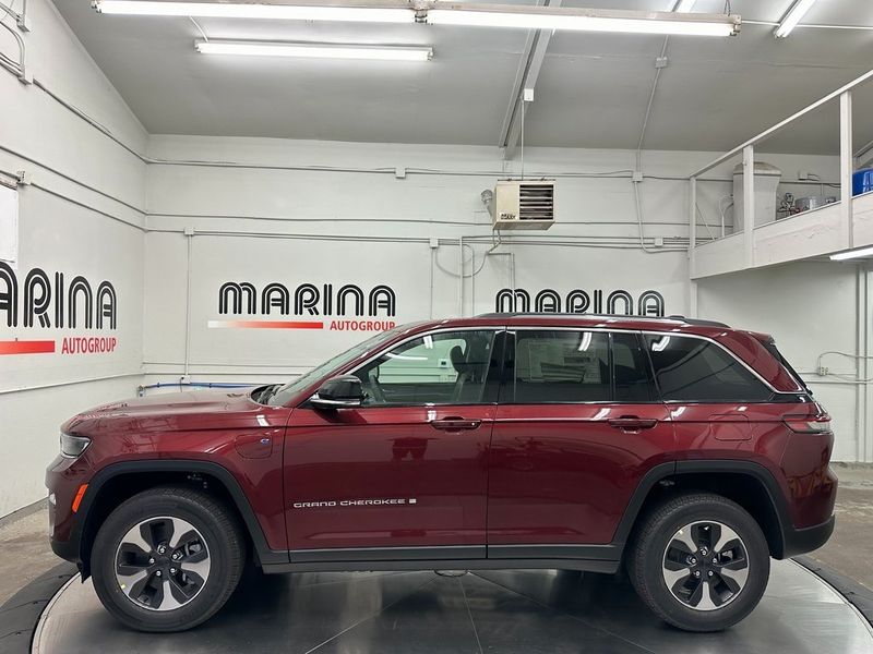 2024 Jeep Grand Cherokee 4xe in a Velvet Red Pearl Coat exterior color and Global Blackinterior. Marina Auto Group (855) 564-8688 marinaautogroup.com 