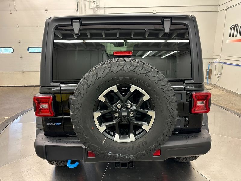 2024 Jeep Wrangler 4-door Rubicon 4xe in a Black Clear Coat exterior color and Blackinterior. Marina Auto Group (855) 564-8688 marinaautogroup.com 