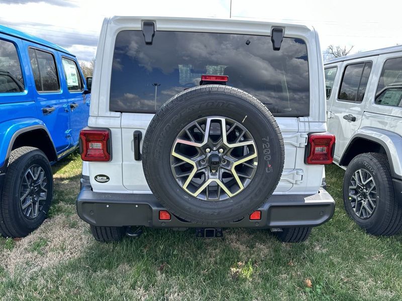 2024 Jeep Wrangler 4-door Sahara in a Bright White Clear Coat exterior color. Gupton Motors Inc 615-384-2886 guptonmotors.com 