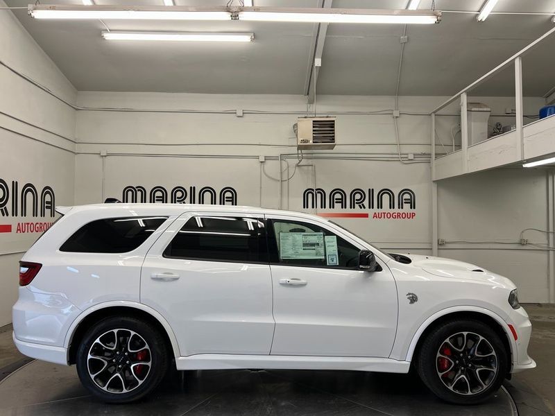 2023 Dodge Durango Srt Hellcat Plus Awd in a White Knuckle Clear Coat exterior color and Demonic Red/Blackinterior. Marina Auto Group (855) 564-8688 marinaautogroup.com 