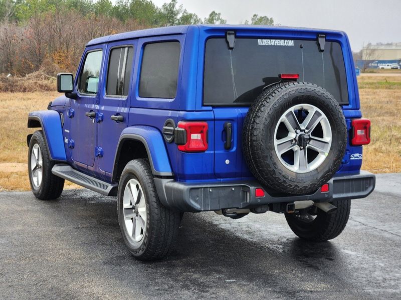 2020 Jeep Wrangler Unlimited Sahara in a Ocean Blue Metallic Clear Coat exterior color and Blackinterior. Elder Chrysler Dodge Jeep Ram 9032920419 elderchryslerdodgejeep.com 