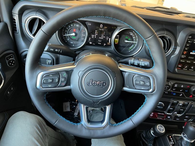 2023 Jeep Wrangler Rubicon 4xe in a Silver Zynith Clear Coat exterior color and Blackinterior. Marina Auto Group (855) 564-8688 marinaautogroup.com 