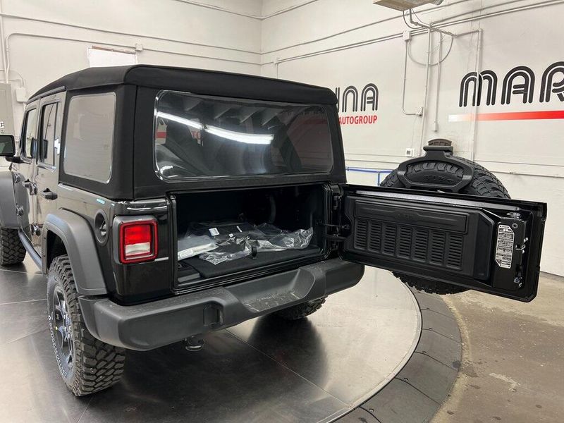 2023 Jeep Wrangler 4-door Willys 4x4 in a Black Clear Coat exterior color and Blackinterior. Marina Chrysler Dodge Jeep RAM (855) 616-8084 marinadodgeny.com 