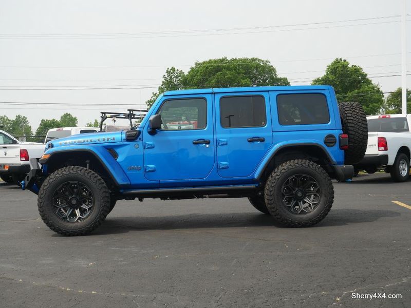 2023 Jeep Wrangler Rubicon 4xe in a Hydro Blue Pearl Coat exterior color and Black/Dark Saddleinterior. Paul Sherry Chrysler Dodge Jeep RAM (937) 749-7061 sherrychrysler.net 