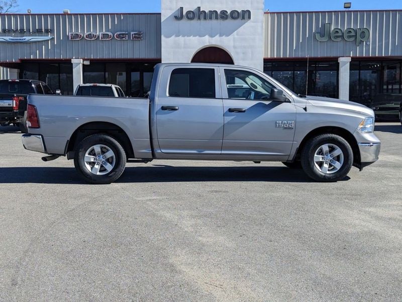 2022 RAM 1500 Classic SLT in a Billet Silver Metallic Clear Coat exterior color and Diesel Gray/Blackinterior. Johnson Dodge 601-693-6343 pixelmotiondemo.com 