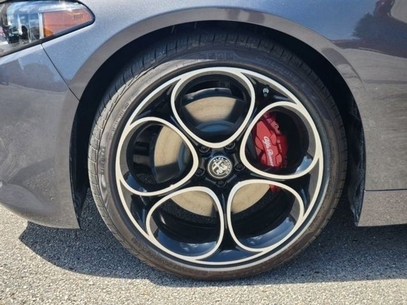 2024 Alfa Romeo Giulia Ti in a Vesuvio Gray Metallic exterior color and Blackinterior. Northside Imports Houston 281-475-4549 northsideimportshouston.com 