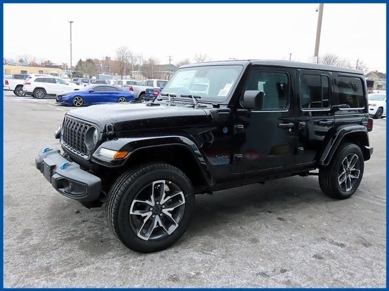 2024 Jeep Wrangler 4xE Sport S 4xe in a Black Clear Coat exterior color and Blackinterior. Papas Jeep Ram In New Britain, CT 860-356-0523 papasjeepram.com 