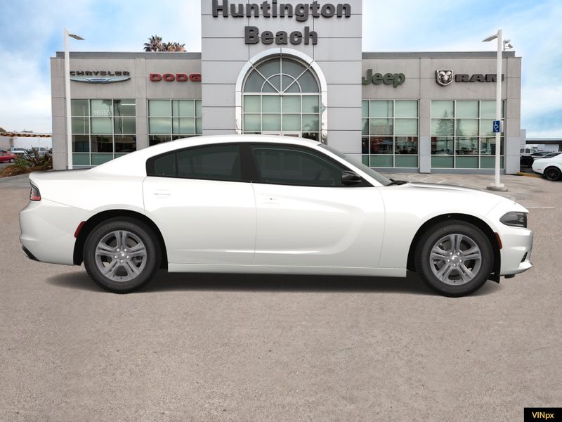 2023 Dodge Charger SXT in a White Knuckle exterior color and Blackinterior. BEACH BLVD OF CARS beachblvdofcars.com 