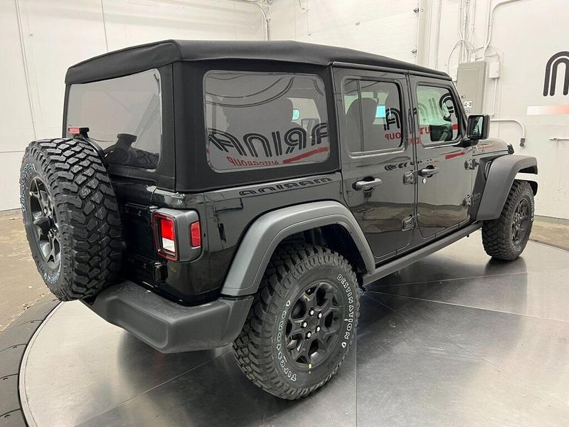 2023 Jeep Wrangler 4-door Willys 4x4 in a Black Clear Coat exterior color and Blackinterior. Marina Chrysler Dodge Jeep RAM (855) 616-8084 marinadodgeny.com 