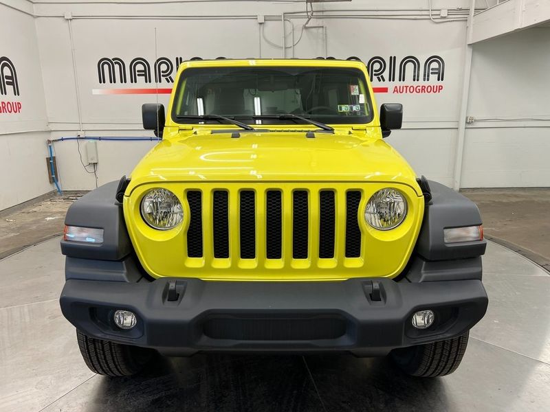 2023 Jeep Wrangler 4-door Sport S 4x4 in a High Velocity Clear Coat exterior color and Blackinterior. Marina Chrysler Dodge Jeep RAM (855) 616-8084 marinadodgeny.com 